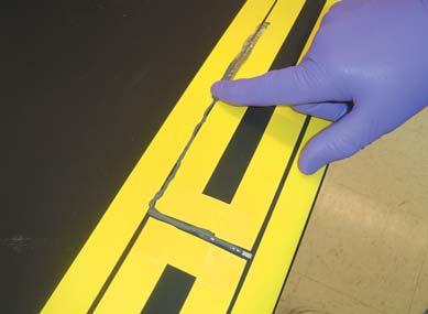 Use a rubber glove on a finger or a squeegee to smooth out the sealant. Figure 12 Figure 13 18.) Remove the 3M 471 Tape after about 30 minutes, before the sealant has cured.