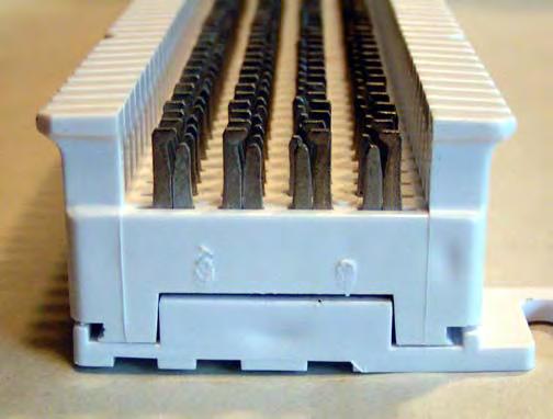 You will install a 66 block, which is common in telephone applications because it provides a quick way to connect telephone lines. The 66 block has 50 rows of connectors, or terminals.