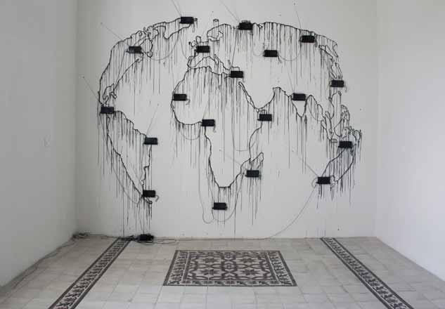 Essay 51 Mohamed El-Baz, IMAGINE, 2010, installation (paint, audio devices, mixed media), 395 x 93 cm. Courtesy of the artist and Darat al Funun.