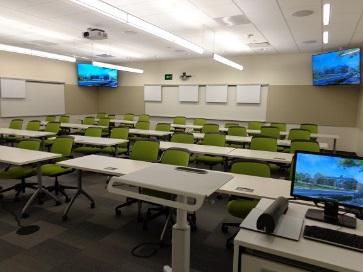Each classroom has one (1) projector; 2 flat panel displays on the back walls; moveable white