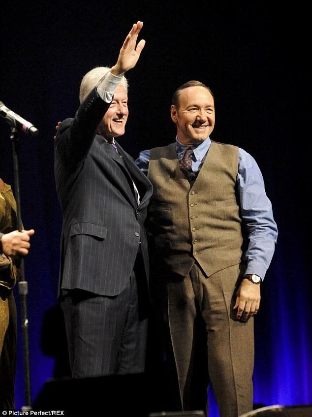 Kevin Spacey (right) congratulates former president Bill