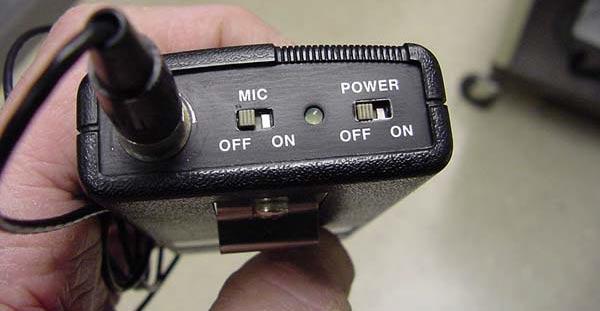 The transmitter should be clipped to your belt or pocket.