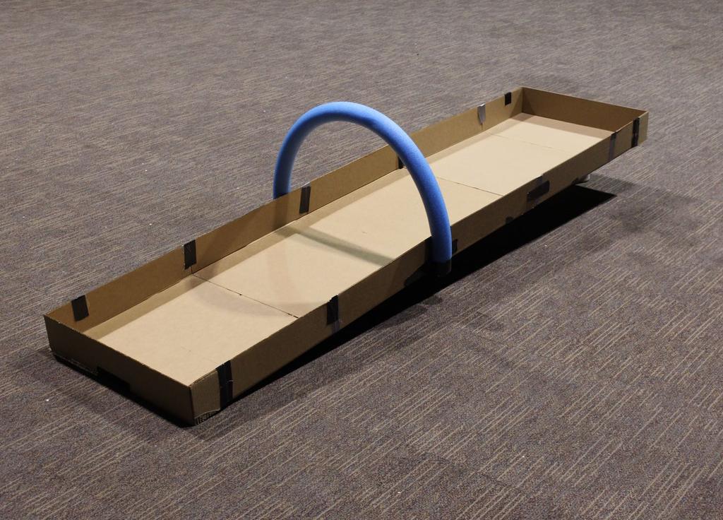 Measure 23 inches in the middle of your cardboard or foamcore to create the track. Mark both sides of the track with a pencil.