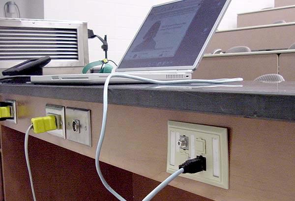 Data and power connections are on the back of the lab table.