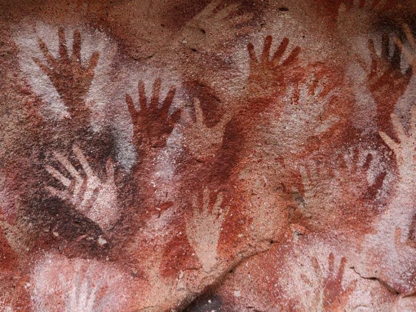 This is Cueva de las Manos (Cave of Hands) in Argentina. But similar works of primitive art exist on almost all continents.