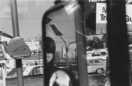 Lee Friedlander Hillcrest, NY 1970, printed later Lee Friedlander is known for composing images on the street in which fragments of elements such as street signs, light posts, buildings, pavement,