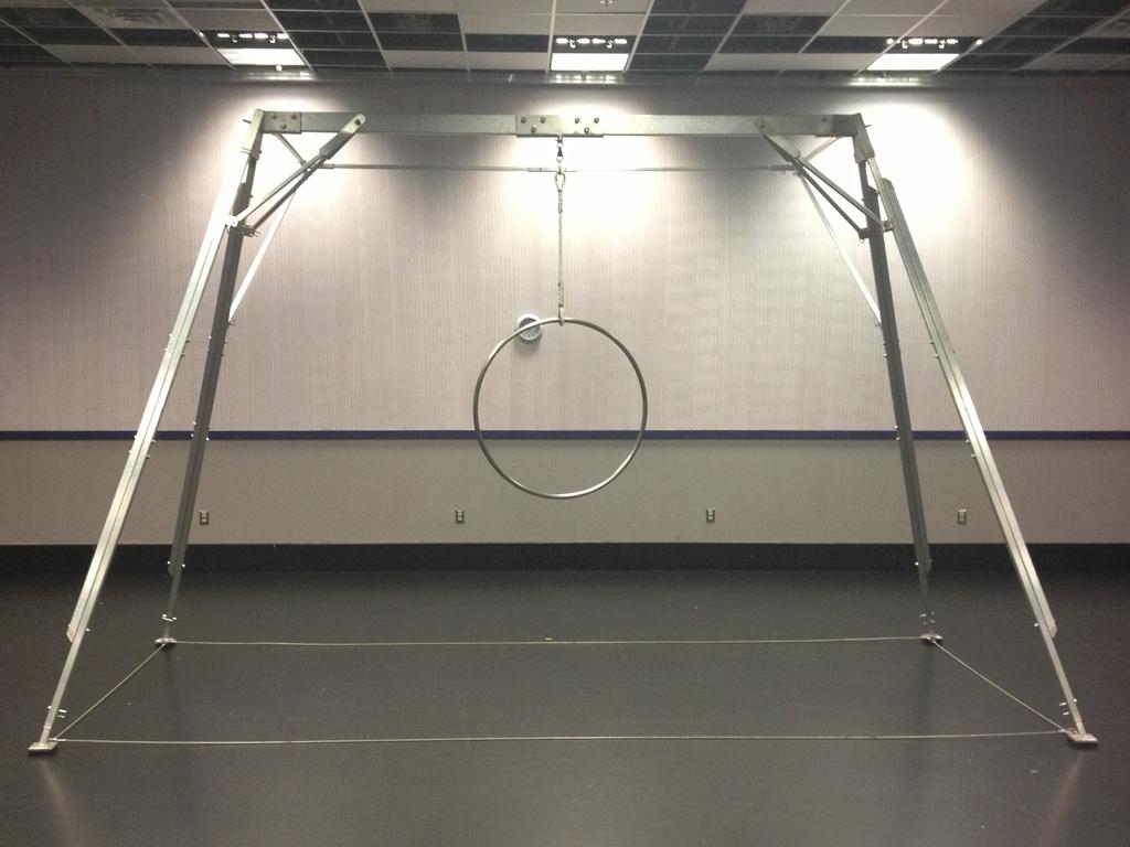 The Set consists of a free-standing aerial rig made out of light weight aluminum that stands approx. 10 high. On the back extension of the rig hangs a Black Sharkstooth scrim.