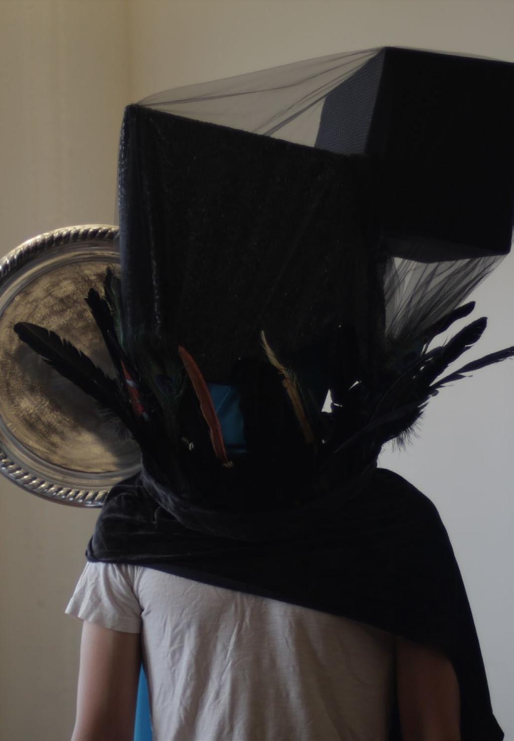 The crazy headdress is formed by a couple of skewed cube shapes on top of each other.