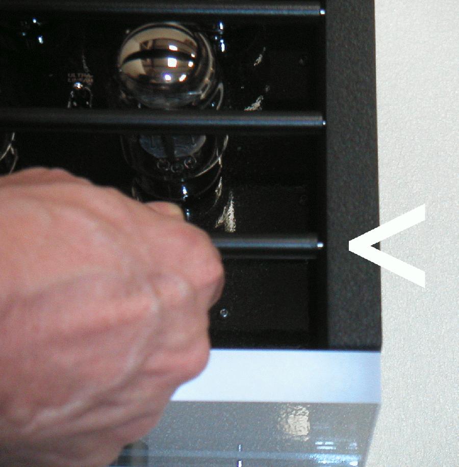 To complete the installation, press the bar in the direction of the pin already inserted, and manoeuver the other end into the corresponding dimple in the other side rail, then
