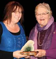 Olga E. Harding, new New Zealand Playwriting Award for Wedding Party by TJ Ramsay. Here TJ receives the mounted pounamu from Nanette Wright.