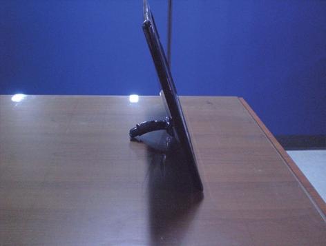 After pull the stand body up,take the monitor up carefully and face the front side.