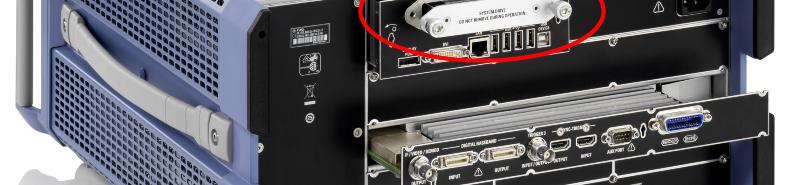 IMPORTANT: Switch off the instrument and disconnect the power plug before removing the solid-state drive! 2. Unscrew the two knurled screws and remove the solid-state drive at the rear of the device.