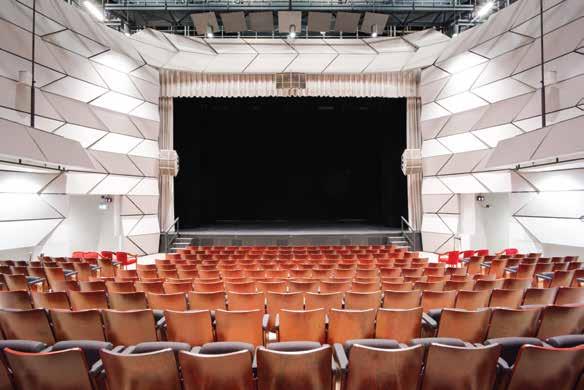 Translucent acoustic panels wrap the theatre walls and are