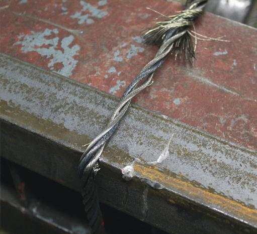 If I had continued to apply force, the remaining strands would have failed, but the load would have been lower that the first failure point. Detail of failure over angle.