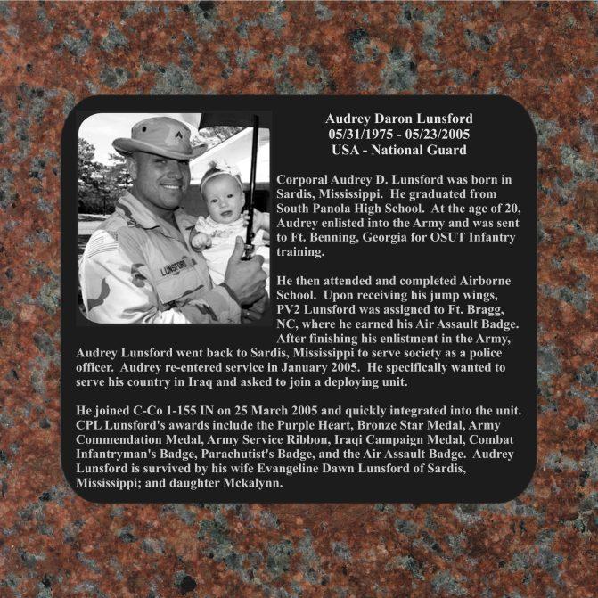 This tribute was etched into black surgical stainless steel and recessed into Radiant Red granite.