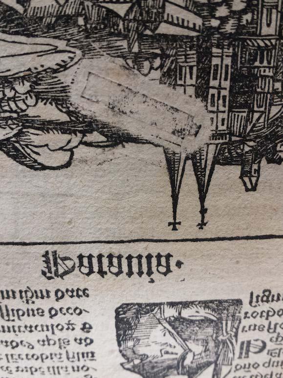A close-up of Gutenberg's groundbreaking invention: a single loose type has left an imprint on a woodcut illustration.