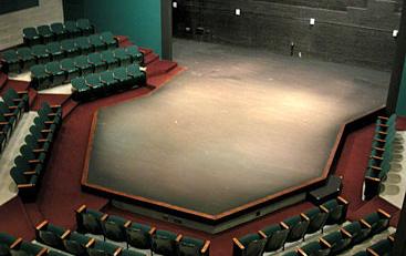 THRUST STAGE: With a thrust stage, seating is usually arranged around three sides of a raised platform, bringing more of the audience closer to the action than is possible in a proscenium theater of