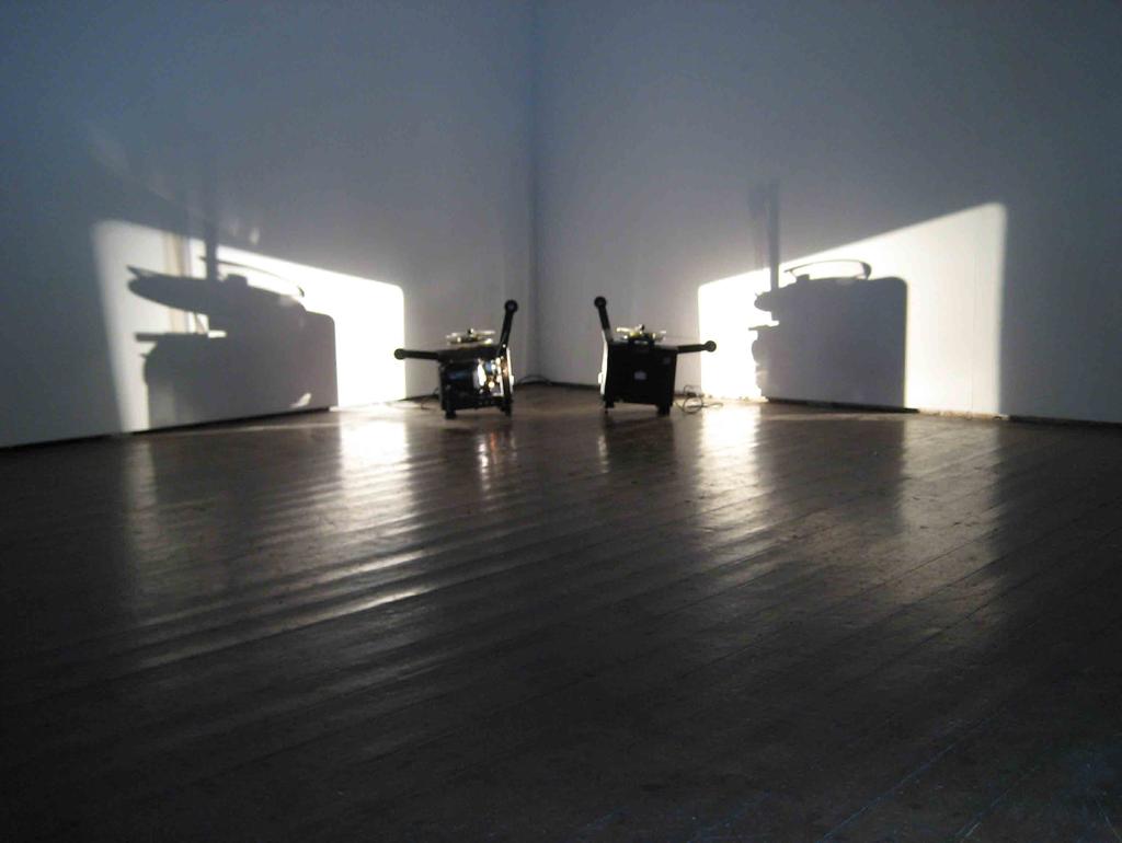 Western Round Table, 2007. Two 16mm films, two projectors, two loops, optical sound. Installation view, LUX, London, 2009.