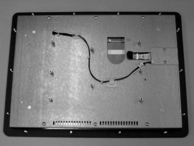 Remove the two screws and touchscreen cable cover from the right edge of the display plate. See Figure 4. 6.