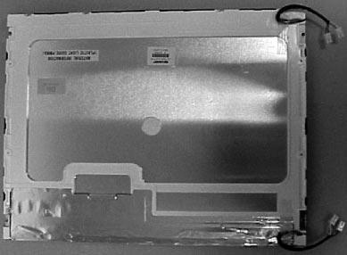 The inverter has to be removed in order to disconnect the backlight cables. 8. Remove the screws from the four corners of the display. See Figure 5. 9.
