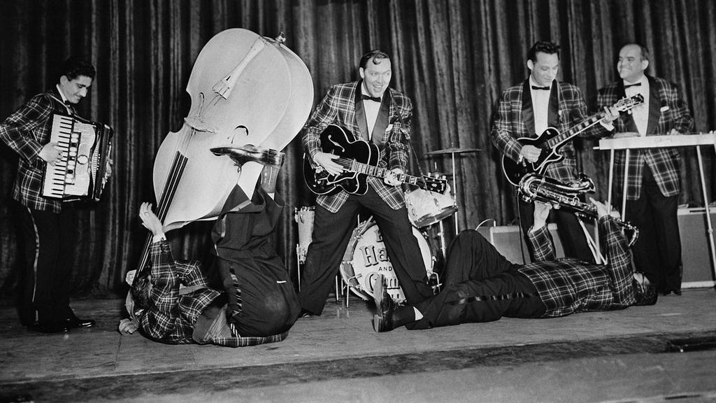 BILL HALEY AND THE COMETS Musical career spanned three music markets (pop, R & B, C & W) Started as a C & W star, but loved R & B and would often cover R & B songs with appropriate versions