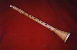 The medieval version of the flute is the recorder it is a wooden instrument that is held straight (as opposed to off to the side like a modern flute.