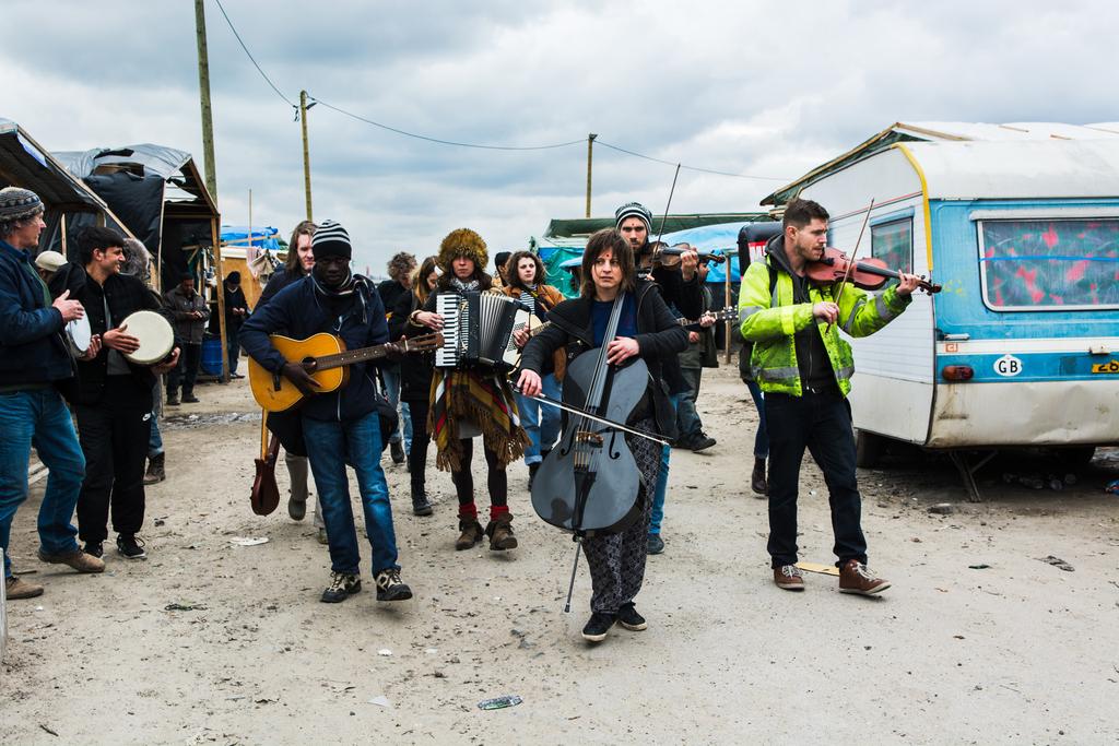 Musicians from The Calais Sessions walking