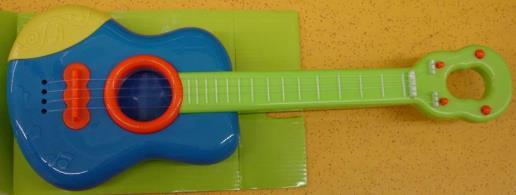 Brightly coloured plastic guitar with 4 strings and frets. Dimensions about 44 cm x 16 cm, height about 6 cm, weight about 310 g. Strings cannot be properly tuned. 8124-8 Table 4.