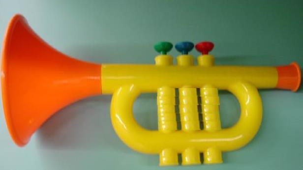 No information whether the keys are properly tuned. Musical quality is not the objective. Brightly coloured plastic trumpet, with a paper sticker.