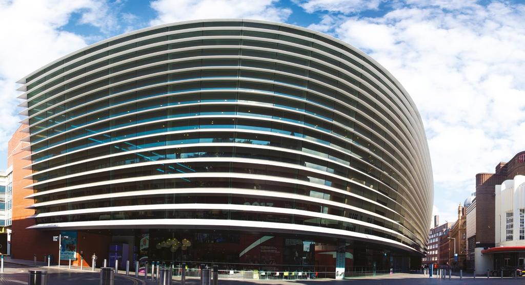 About Curve Curve is a large, round building with a glass front.
