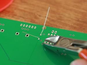 The soldered diode getting its legs cut.