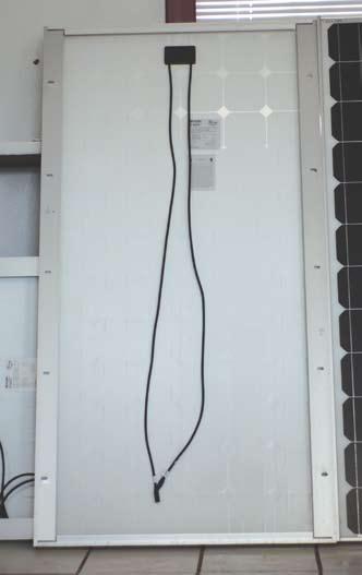 Photo 1. Modern PV module with leads and connectors Inset 1.
